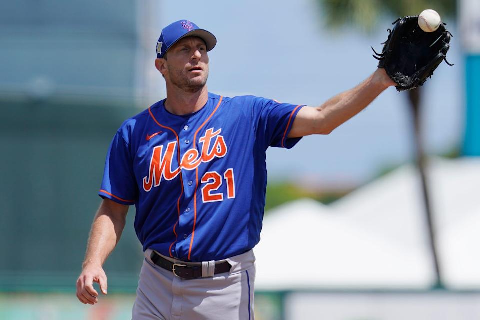 New York Mets' Max Scherzer takes a throw from the catcher in the second inning of a spring training baseball game against the Miami Marlins, Monday, March 21, 2022, in Jupiter, Fl. (AP Photo/Sue Ogrocki)