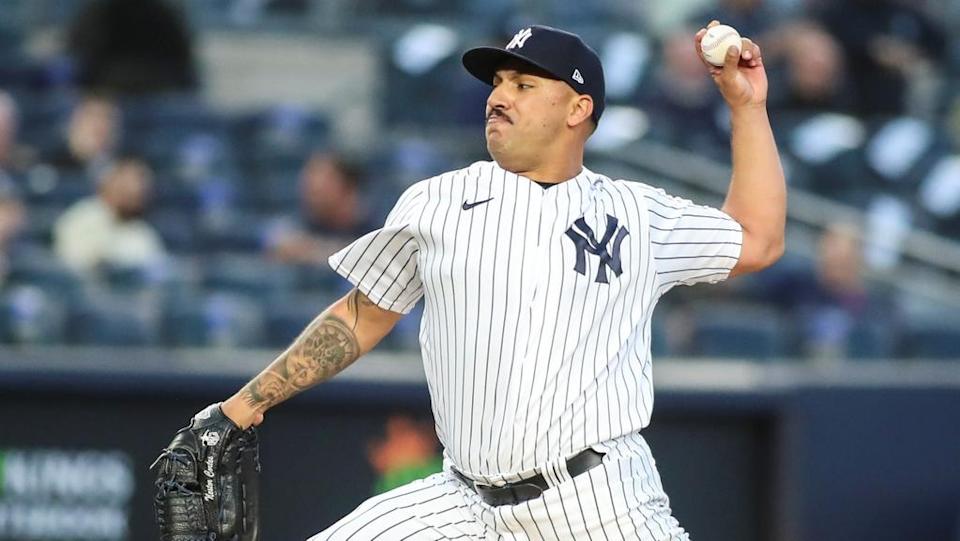 Nestor Cortes close up in pinstripes about to pitch