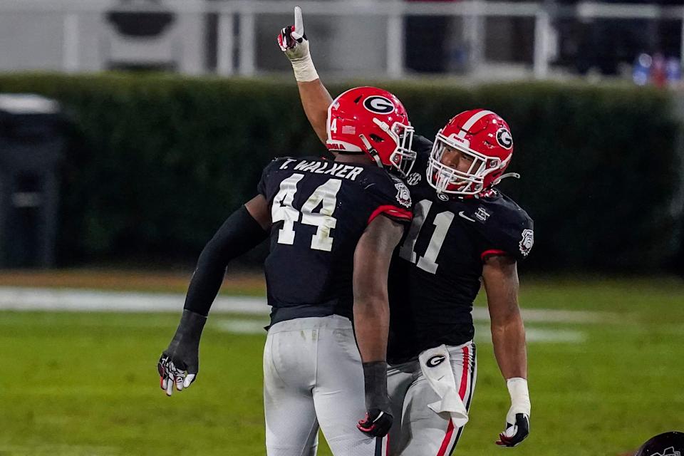 Travon Walker and Jermaine Johnson (seen here with Georgia in 2020) are projected to go in the top 10 in the USA TODAY Sports Network's mock draft.