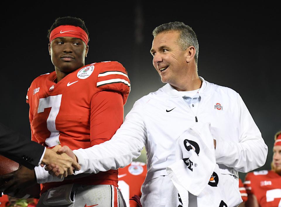 Dwayne Haskins and Ohio State coach Urban Meyer on the podium after defeating Washington in the 2019 Rose Bowl.