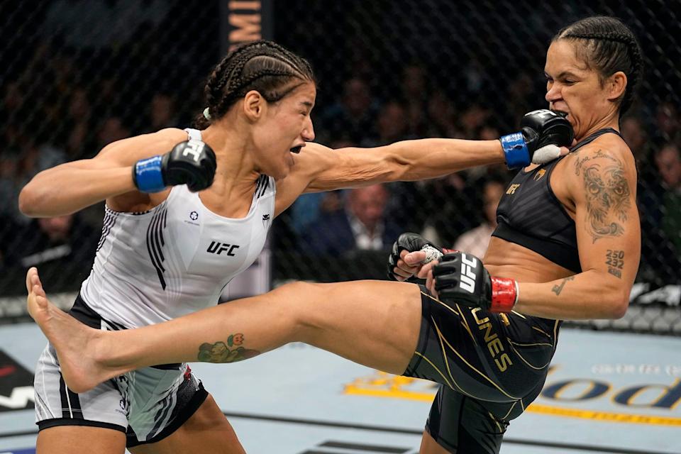 Julianna Pena punches Amanda Nunes en route to her shock win at a UFC event.