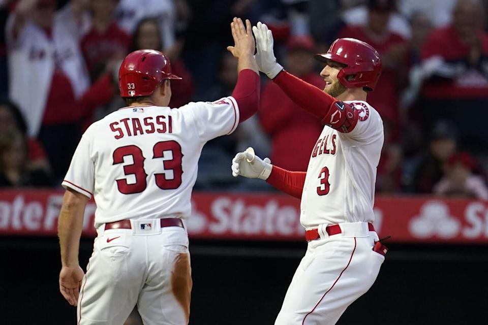 Angels' Taylor Ward is met at home plate by Max Stassi after Ward's grand slam.