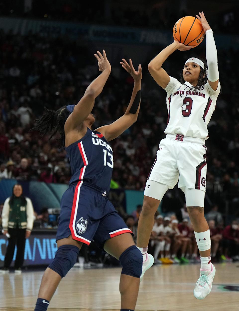 South Carolina's Destanni Henderson goes up for a jumper against UConn in the first half.