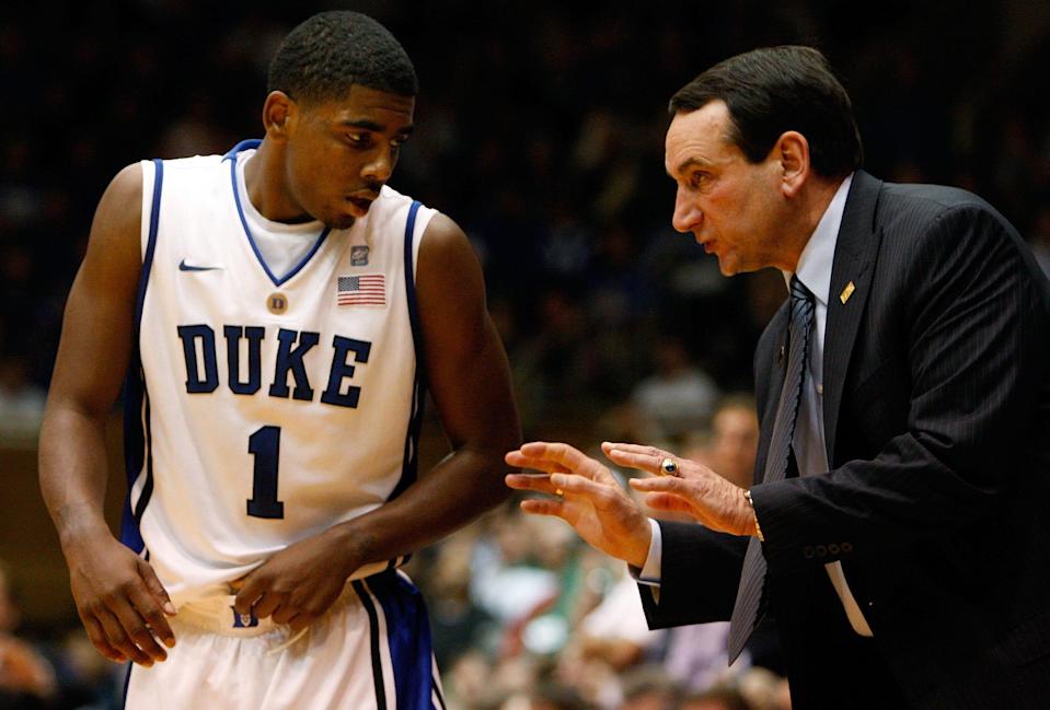 Kyrie Irving listens to Duke coach Mike Krzyzewski