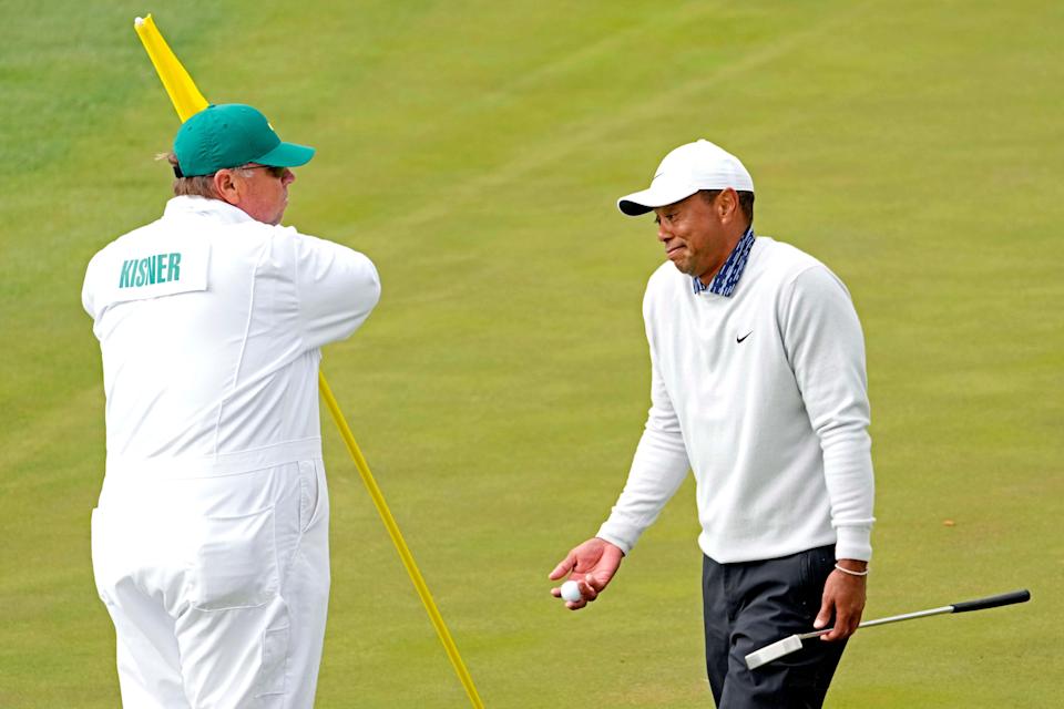 Tiger Woods reacts to his putt on the 15th green during the third round of The Masters golf tournament.