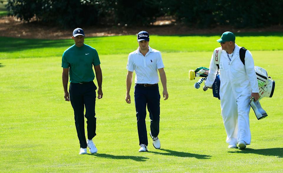Tiger Woods and Justin Thomas walk the course at Augusta National