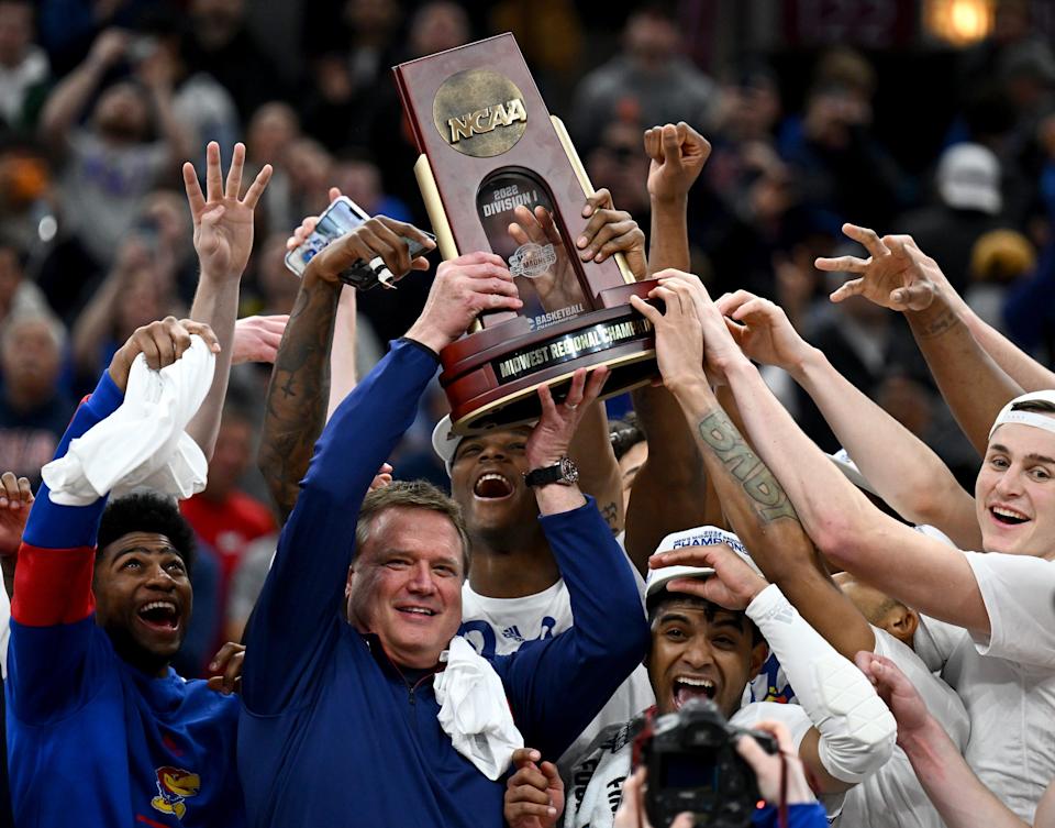 Kansas coach Bill Self celebrates with his team after advancing to the Final Four by defeating Miami in the Midwest regional final.