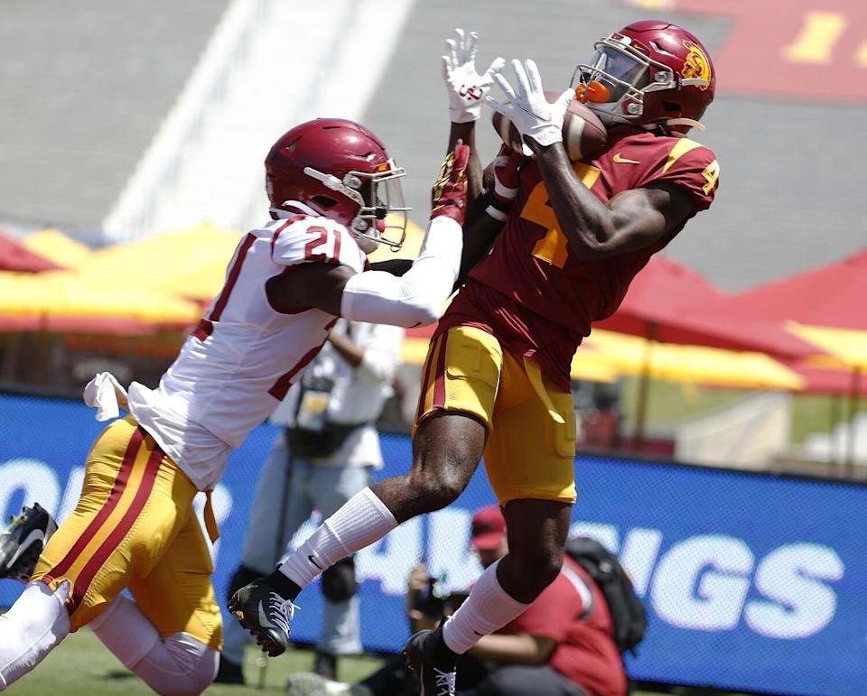 USC receiver Mario Williams catches a touchdown pass in front of defensive back Latrell McCutchin