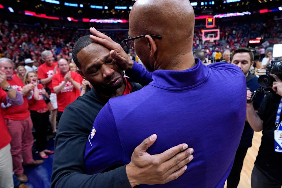 Phoenix Suns head coach Monty Williams wipes tears from the face of New Orleans Pelicans head coach Willie Green after an NBA basketball first-round playoff series, Thursday, April 28, 2022 in New Orleans.