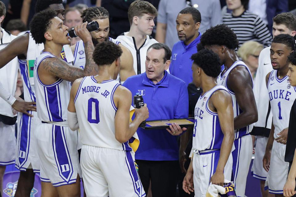 Mike Krzyzewski huddles with his team in the second half against North Carolina.