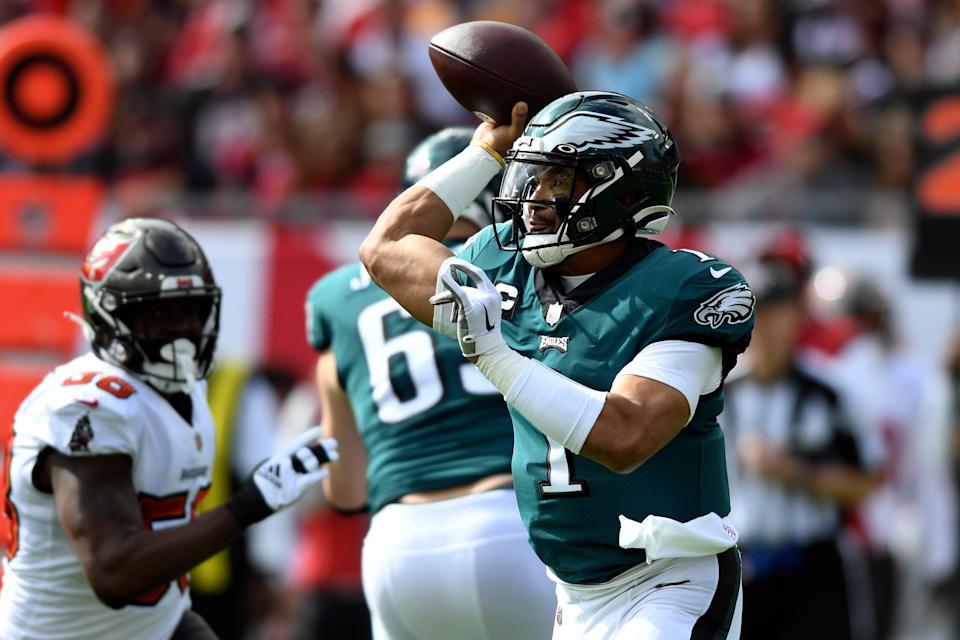 Philadelphia Eagles quarterback Jalen Hurts (1) throws a pass against the Tampa Bay Buccaneers during the first half of an NFL wild-card football game Sunday, Jan. 16, 2022, in Tampa, Fla.