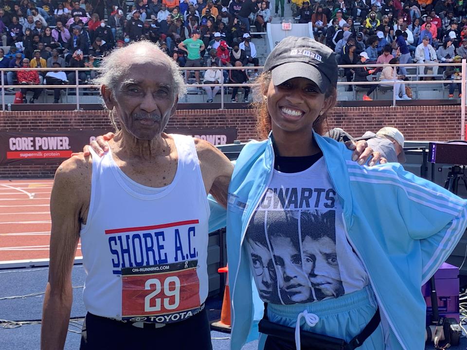 Long Branch 100-year-old Lester Wright with his great-granddaughter Brinala Wall after racing at the Penn Relays