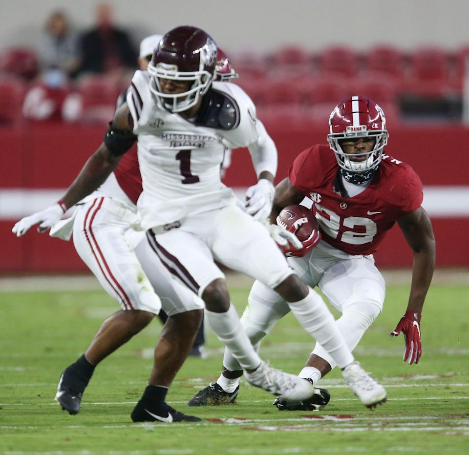 Oct 31, 2020; Tuscaloosa, Alabama, USA; Mississippi State cornerback Martin Emerson (1) tries to turn away from a block as Alabama running back Najee Harris (22) runs the ball at Bryant-Denny Stadium. Mandatory Credit: Gary Cosby Jr/The Tuscaloosa News via USA TODAY Sports