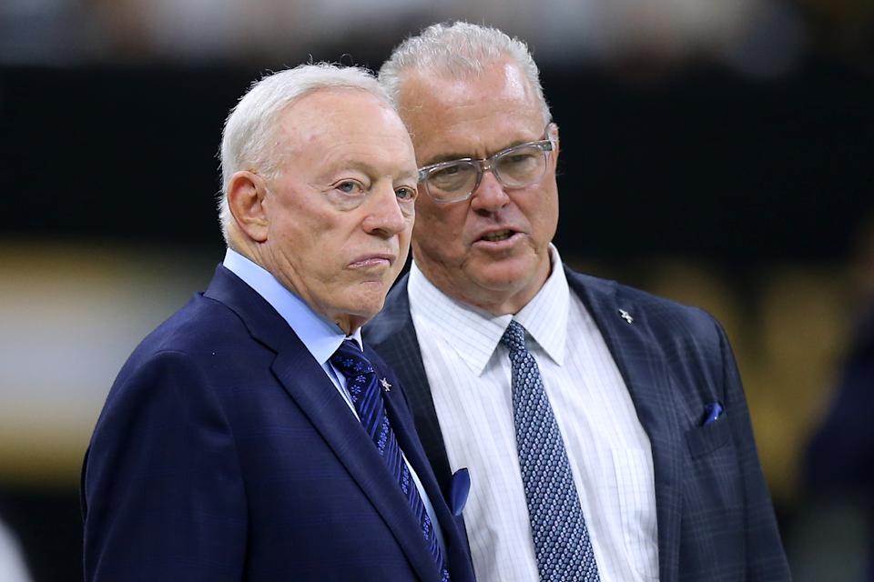 Cowboys team owner Jerry Jones, left, might do well to listen to his son Stephen and not hold up draft boards for all the world to see. (Photo by Jonathan Bachman/Getty Images)