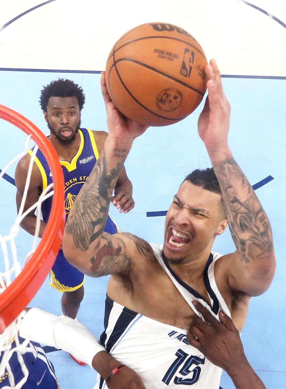 May 1, 2022; Memphis, Tennessee, USA; Memphis Grizzlies forward Brandon Clarke is fouled by Golden State Warriors forward Draymond Green during game one of the second round for the 2022 NBA playoffs at FedExForum. Mandatory Credit: Joe Rondone-USA TODAY Sports