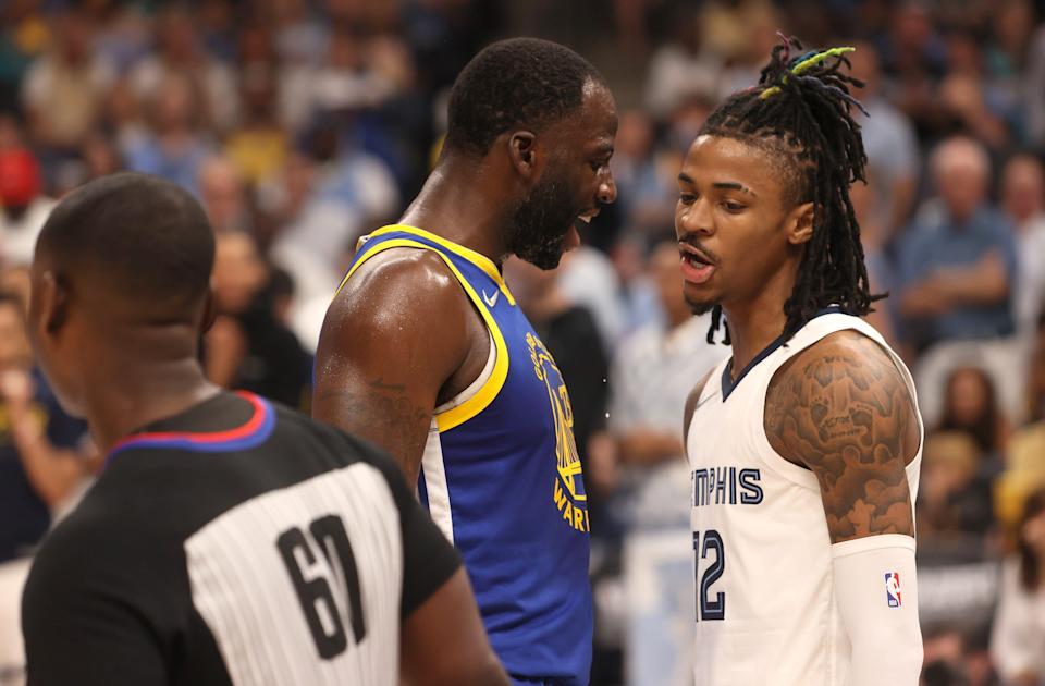 May 1, 2022; Memphis, Tennessee, USA; Golden State Warriors forward Draymond Green (23) gets in the face of Memphis Grizzlies guard Ja Morant (12) during game one of the second round for the 2022 NBA playoffs at FedExForum. Mandatory Credit: Joe Rondone-USA TODAY Sports