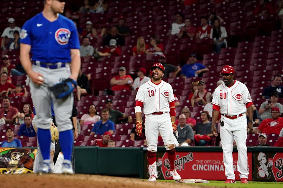 Cincinnati Reds first baseman Joey Votto argues with pitcher Chicago Cubs relief pitcher Rowan Wick.