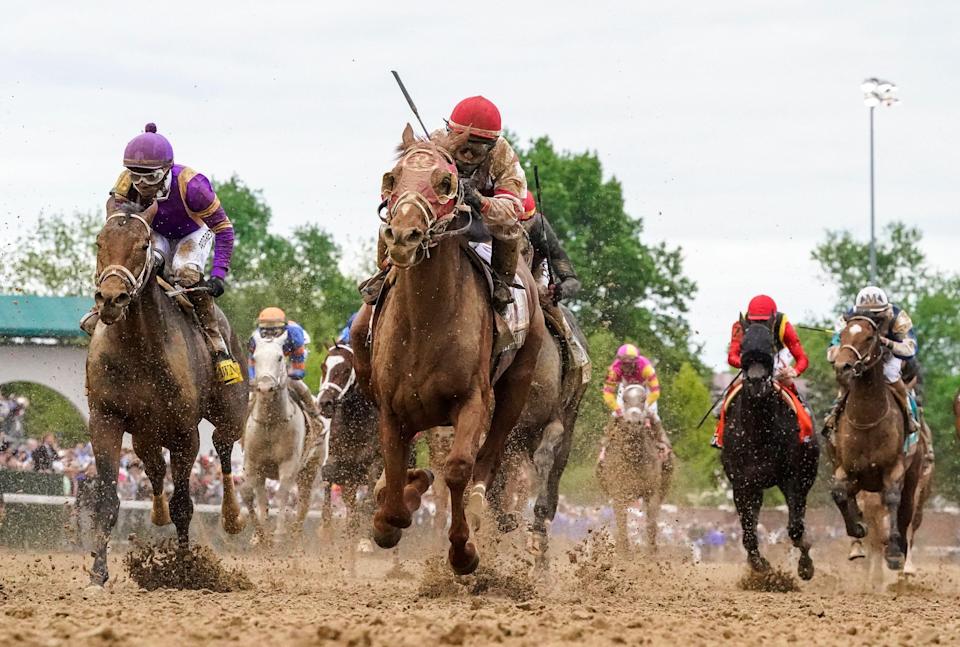 Rich Strike, with Sonny Leon up, runs down the field to win the 148th running of the Kentucky Derby on Saturday, May 7, 2022