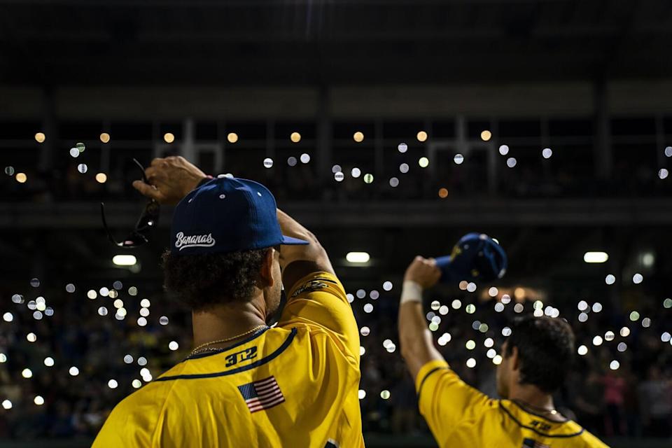 During the seventh inning, Savannah Bananas fans wave their cellphones during the playing of Coldplay's &quot;Yellow.&quot;