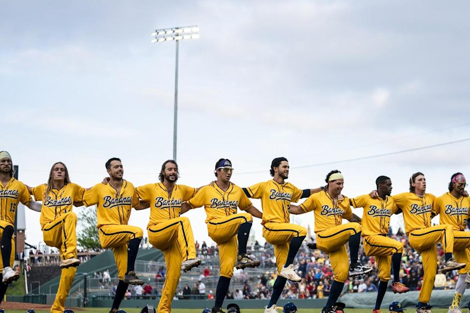 The Savannah Bananas dance together at the start of a banana ball game