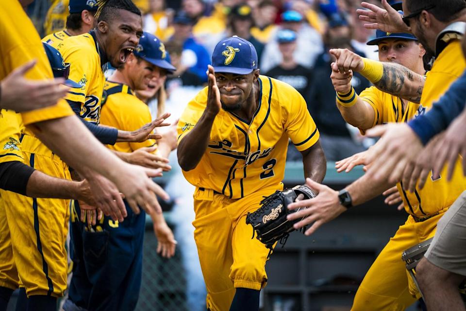 Savannah Bananas outfielder Malachi Mitchell (2) and other members of the starting lineup take to the field.