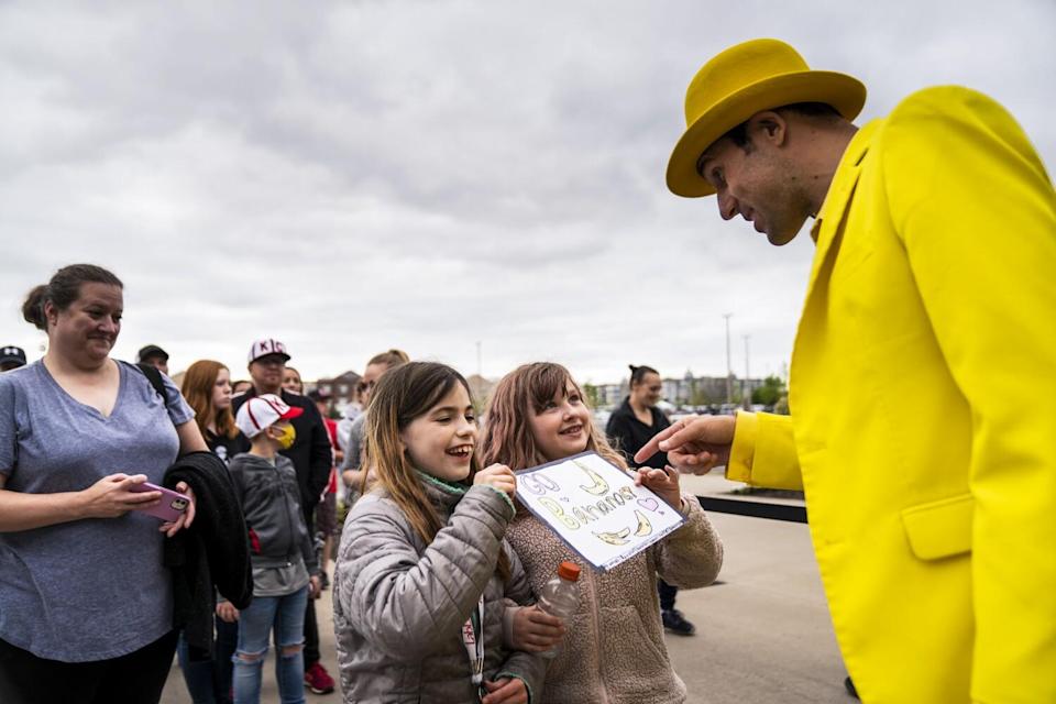 Addison Blobaum, 9, lenexa Amelia Dyck, 9, show their sign supporting the Savannah Bananas to team owner Jesse Cole.