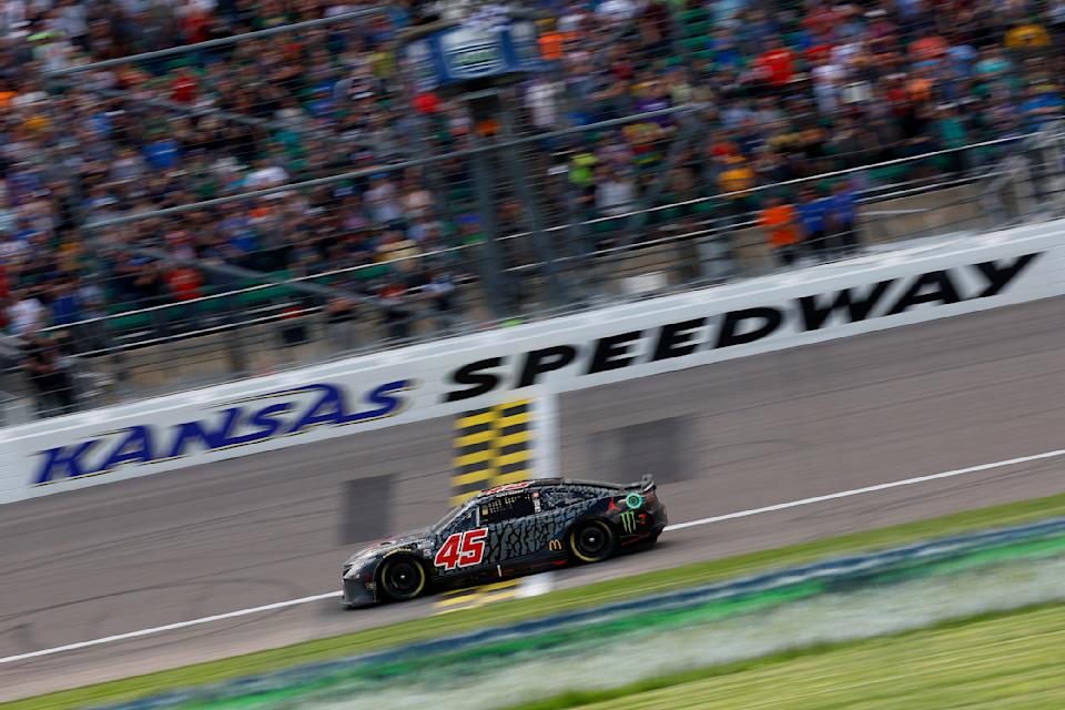 KANSAS CITY, KANSAS - MAY 15: Kurt Busch, driver of the #45 Jordan Brand Toyota, crosses the finish line to win the NASCAR Cup Series AdventHealth 400 at Kansas Speedway on May 15, 2022 in Kansas City, Kansas. (Photo by Chris Graythen/Getty Images)