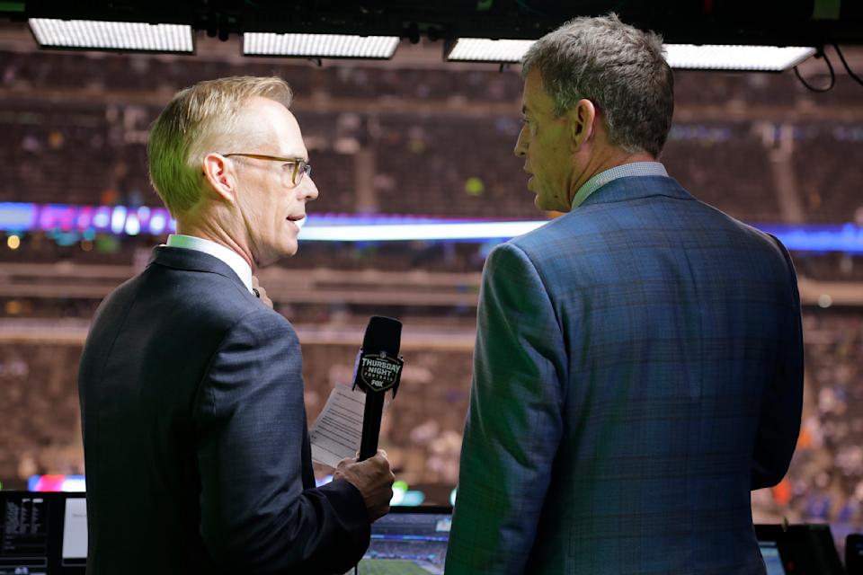 Joe Buck (left) and Troy Aikman will continue their long-running partnership on ESPN. (AP Photo/Frank Franklin II, File)