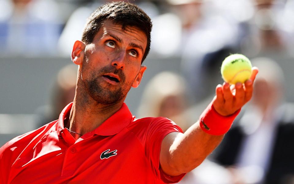 Novak Djokovic of Serbia serves in the Men's Singles Third Round match against Aljaz Bedene of Slovenia during Day Six of The 2022 French Open at Roland Garros on May 27, 2022 in Paris, France - GETTY IMAGES