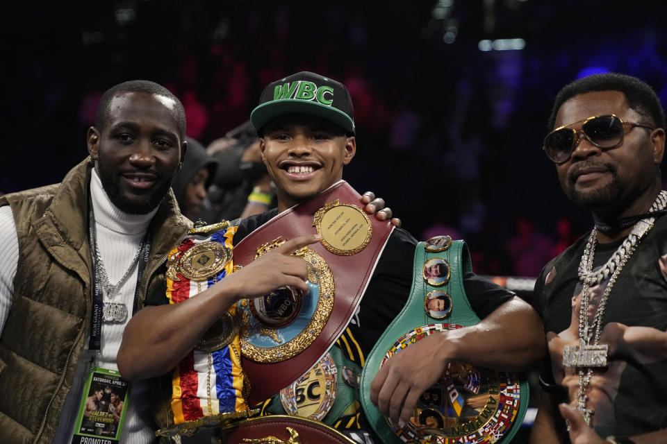 Shakur Stevenson, center, celebrates after defeating Oscar Valdez during a WBC-WBO junior lightweight title boxing bout Saturday, April 30, 2022, in Las Vegas. (AP Photo/John Locher)