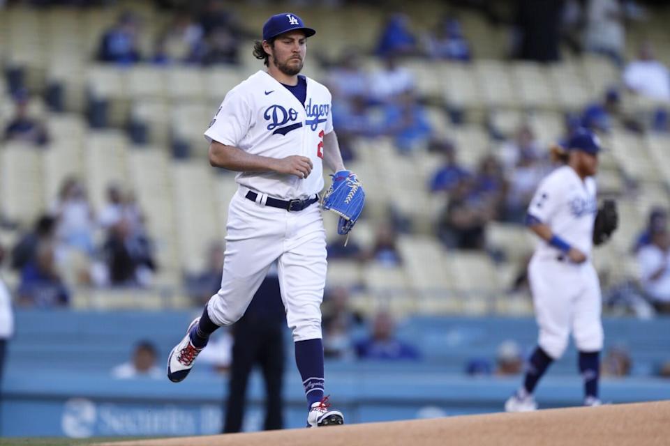 Dodgers starting pitcher Trevor Bauer runs out to the mound before a game against the Texas Rangers in June.