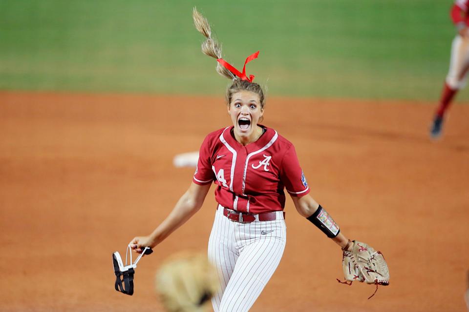 Alabama's Montana Fouts (14) celebrates after pitching a perfect game against UCLA in last June's Women's College World Series.
