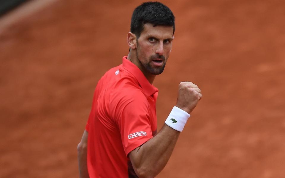 Serbia's Novak Djokovic reacts after winning against Diego Schwartzman during their men's singles match on day eight of the Roland-Garros Open tennis tournament at the Court Suzanne-Lenglen in Paris on May 29, 2022. - GETTY IMAGES