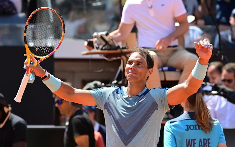 Spain's Rafael Nadal celebrates winning his second round match against John Isner of the U.S. - REUTERS