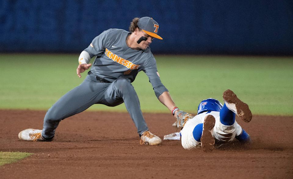 May 28, 2022; Hoover, AL, USA; Tennessee shortstop Cortland Lawson (9) tags out Kentucky catcher Devin Burkes (7) on a steal attempt at second base in the SEC Tournament at the Hoover Met in Hoover, Ala., Saturday. Mandatory Credit: Gary Cosby Jr.-The Tuscaloosa News