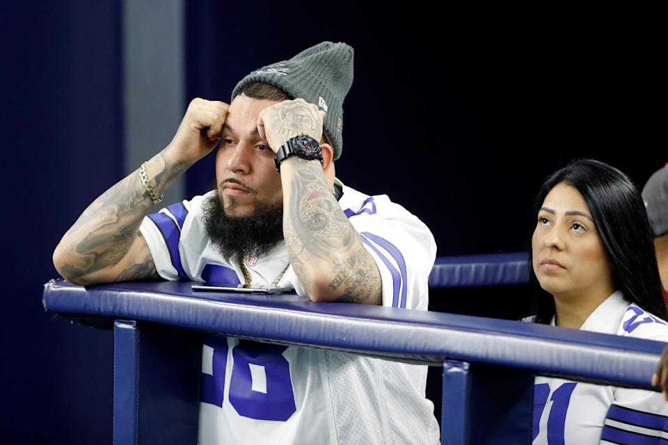 The eternal look of a Cowboys fan at the end of the season after another missed playoffs: sadness. (AP Photo/Roger Steinman)