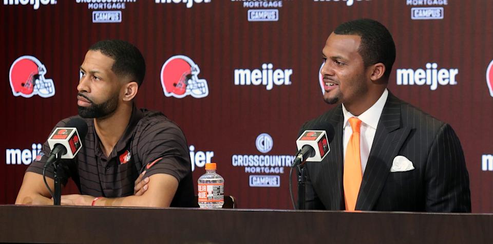 Cleveland Browns quarterback Deshaun Watson, right, smiles as he answers questions while general manager Andrew Berry looks on during Watson's introductory press conference at the Cleveland Browns Training Facility in Berea.