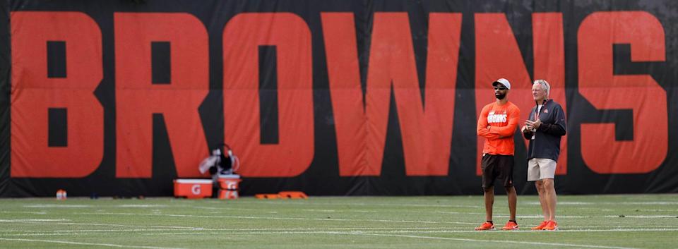 Cleveland Browns General Manager Andrew Berry, left, and owner Jimmy Haslam observe from the sideline during an NFL football practice at the team's training facility, Tuesday, June 15, 2021, in Berea, Ohio.