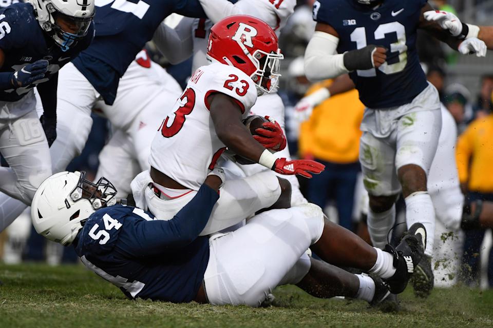 Penn State defensive tackle Derrick Tangelo (54) tackles Rutgers running back Kyle Monangai (23) during the first half of an NCAA college football game in State College, Pa., Saturday, Nov. 20, 2021. (AP Photo/Barry Reeger)