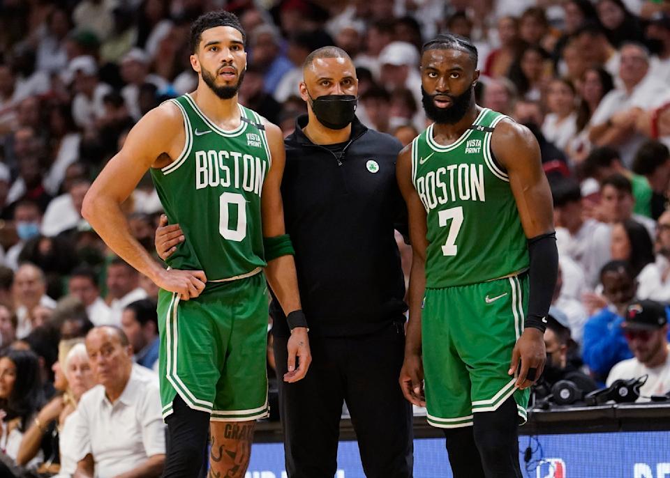 Boston Celtics head coach Ime Udoka speaks to Celtics forward Jayson Tatum and guard Jaylen Brown during a game this postseason. (AP Photo/Lynne Sladky)