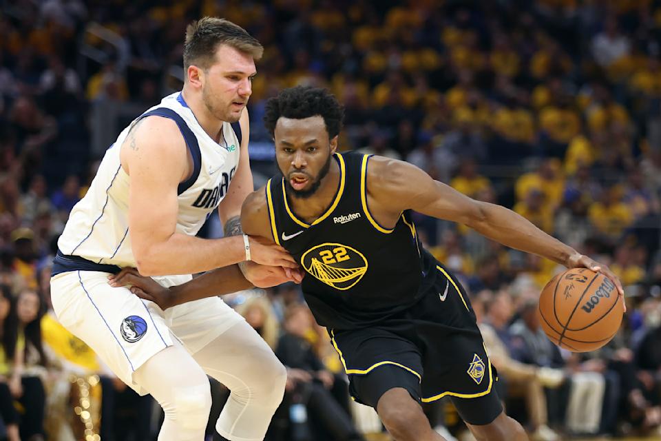 Golden State Warriors forward Andrew Wiggins drives to the basket against Dallas Mavericks guard Luka Doncic during Game 1 of the Western Conference finals at Chase Center in San Francisco on May 18, 2022. (AP Photo/Jed Jacobsohn)