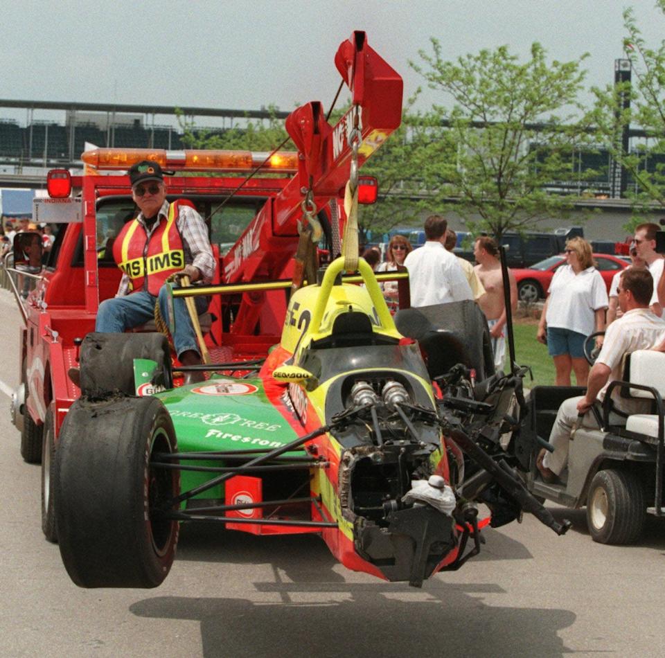 The wreckage of the backup car driven by Scott Brayton is taken to the garage area at IMS, May 17, 1996. Brayton hit the wall during practice, was knocked unconscious and taken directly to Methodist Hospital where he died shortly afterward.