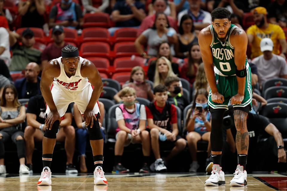 Miami Heat wing Jimmy Butler and Boston Celtics counterpart Jayson Tatum will do battle in the Eastern Conference finals for the second time in three seasons. (Michael Reaves/Getty Images)