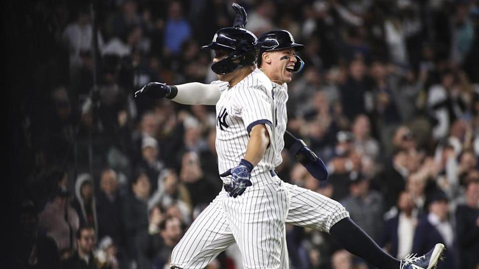 Giancarlo Stanton and Aaron Judge celebrate, jumping