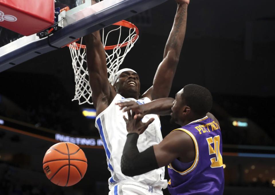 Memphis center Jalen Duren blocks a shot by Tennessee Tech's John Pettway.