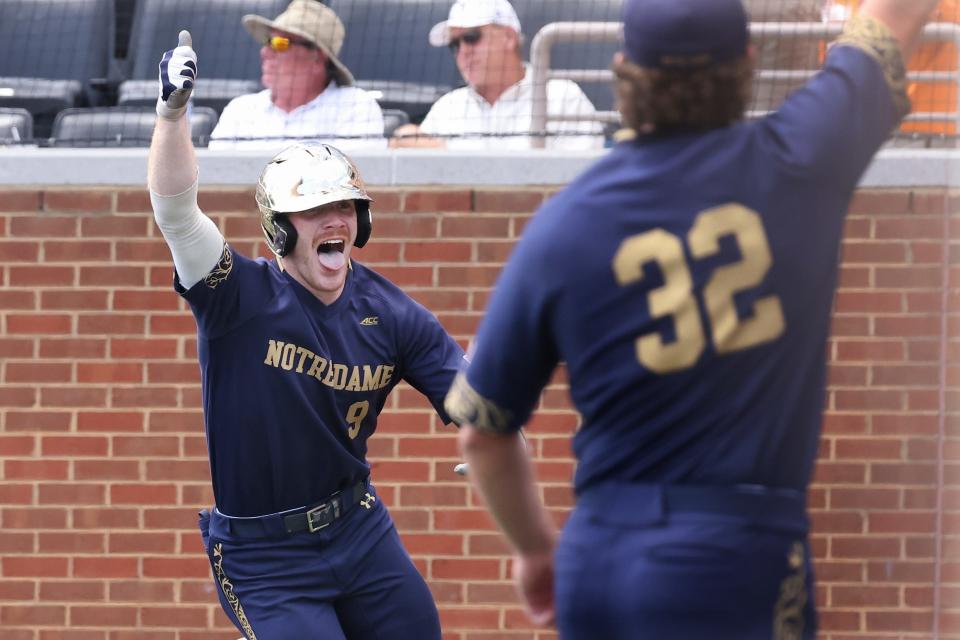 Notre Dame's Jack Brannigan (9) celebrates after hitting a home run against Tennessee. Notre Dame upset top-rated Tennessee to advance to the College World Series.