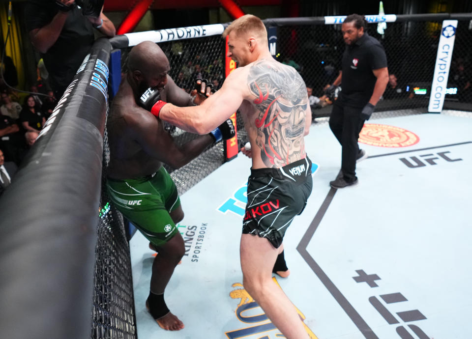 LAS VEGAS, NEVADA - JUNE 04: (R-L) Alexander Volkov of Russia punches Jairzinho Rozenstruik of Suriname in a heavyweight fight during the UFC Fight Night event at UFC APEX on June 04, 2022 in Las Vegas, Nevada. (Photo by Chris Unger/Zuffa LLC)