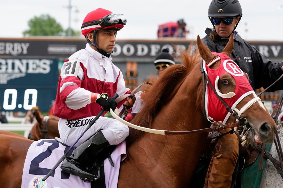 Sonny Leon rides Rich Strike (21) onto the track for the 148th running of the Kentucky Derby horse race at Churchill Downs Saturday, May 7, 2022, in Louisville, Ky.