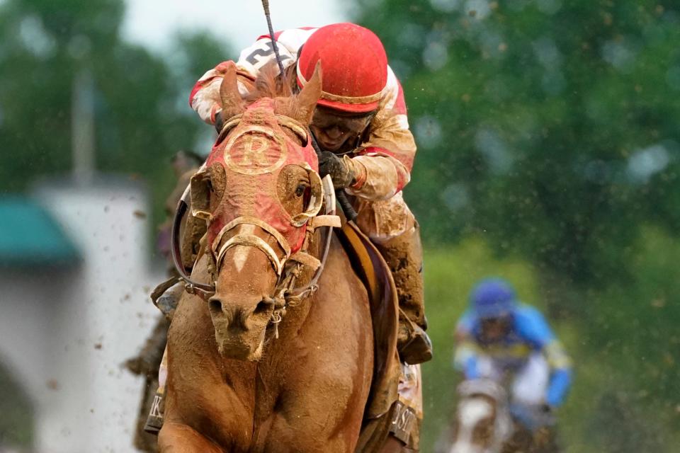 Rich Strike, with Sonny Leon aboard, wins the 148th running of the Kentucky Derby horse race at Churchill Downs Saturday, May 7, 2022, in Louisville, Ky.