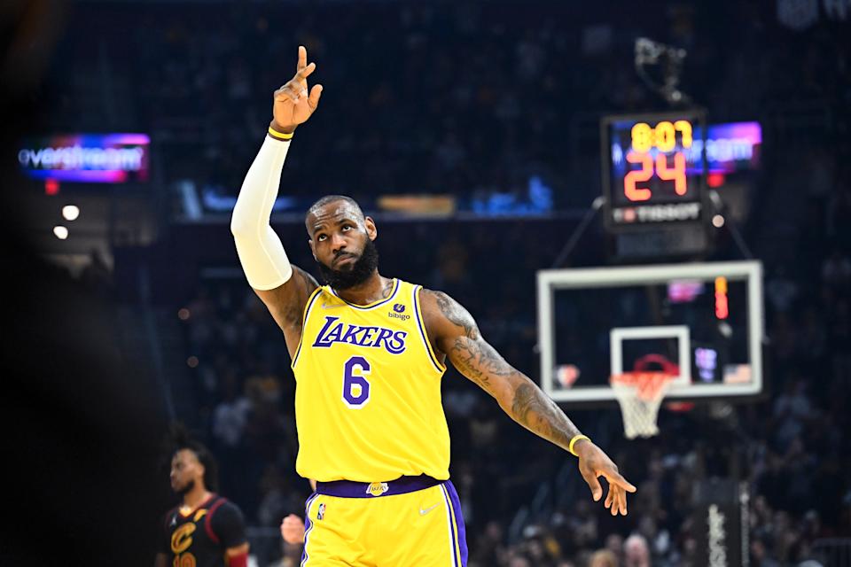 CLEVELAND, OHIO - MARCH 21: LeBron James #6 of the Los Angeles Lakers waves to the crowd during the first quarter against the Cleveland Cavaliers at Rocket Mortgage Fieldhouse on March 21, 2022 in Cleveland, Ohio. NOTE TO USER: User expressly acknowledges and agrees that, by downloading and/or using this photograph, user is consenting to the terms and conditions of the Getty Images License Agreement. (Photo by Jason Miller/Getty Images)